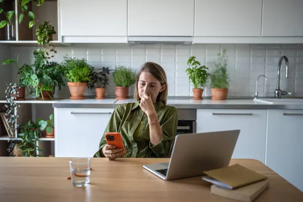 Saddened Stressed Female Sitting Home Table Laptop Reading Disturbing News — Stock Photo, Image