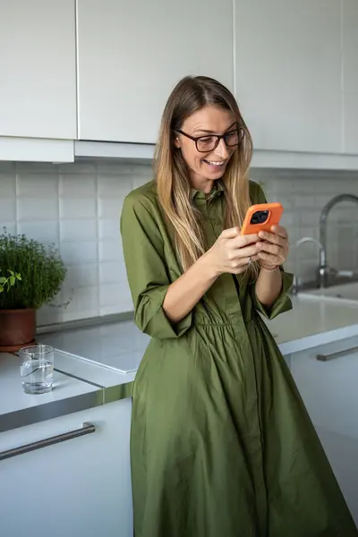 Happy Amazed Contented Female Chatting Friends Mobile Phone Standing Home — Stock Photo, Image