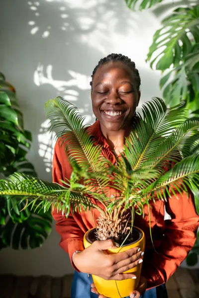 Cheerful Black Woman Holding Cycas Plant Hands Happy Laughing Girl Photos De Stock Libres De Droits