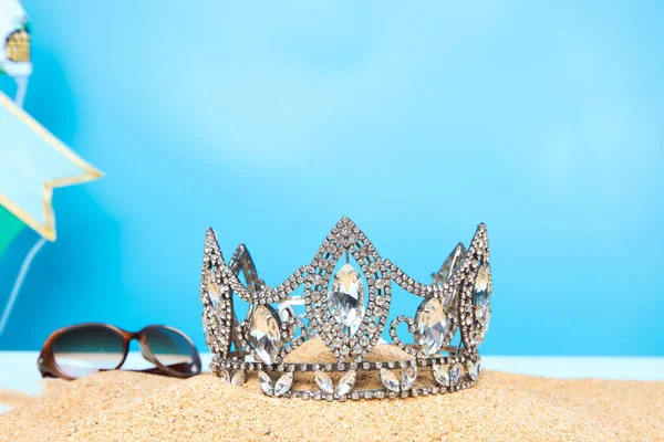 Desert Sand Ocean wind Diamond Crown put into Deep blue sky nature hot tropical island for Miss Beauty Pageant Contest Competition, bikini sash high heel shoes hang on outing trip camping background