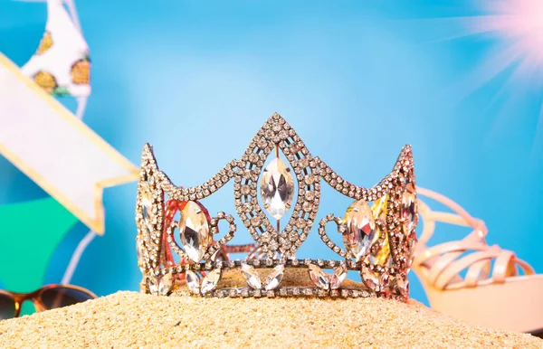 Desert Sand Ocean wind Diamond Crown put into Deep blue sky nature hot tropical island for Miss Beauty Pageant Contest Competition, bikini sash high heel shoes hang on outing trip camping background