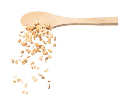 Roasted Peanut bean fall down in wooden spoon, Roasted Peanut bean float explode, abstract cloud fly. Roasted Peanut beans splash throwing in Air. White background Isolated high speed shutter, freeze