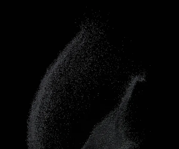 Million of black sand explosion, Photo image of falling down sands flying. Freeze shot on black background isolated overlay. Tiny Fine sand dust magnet as particle disintegrate science