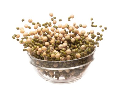 Mix green mung soy beans fall down explosion, several kind bean float explode in glass bowl. Dried soybean green mung mixed beans splash throwing in Air. White background Isolated high speed shutter