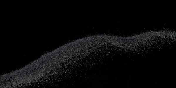 Million of black sand explosion, Photo image of falling down sands flying. Freeze shot on black background isolated overlay. Tiny Fine sand dust magnet as particle disintegrate science