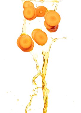 Carrot fresh round slice shape pouring down with water. Beta Carotene orange color in Carrot is good health. Many round slice carrot falling with cooking oil. White background isolated, high speed