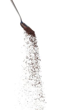 Coffee powder fall down pour in spoon, Coffee crushed float explode, abstract cloud fly. Coffee dust powder splash throwing in Air. White background Isolated high speed shutter, freeze motion