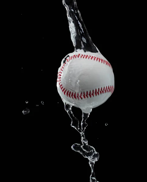 Baseball ball hit water and splash in air. Baseball ball fly in rain and splatter splash in droplet water. Black background isolated freeze action