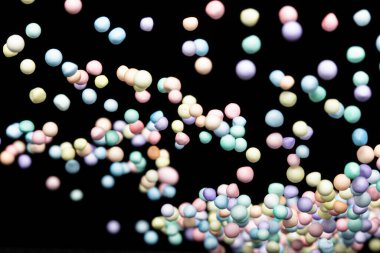 Stil köpük mini top sineği patlaması, Pastel köpük küçük toplar patlar, soyut bulut sineği patlaması. Styrofoam pastel mini küre topları içine hava sıçratıyor. Siyah arkaplan izole edildi