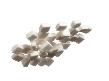 Pure Refined Sugar cube flying explosion, white crystal sugar abstract cloud fly. Pure refined sugar cubes splash stop in air, food object design. white background isolated high speed freeze motion