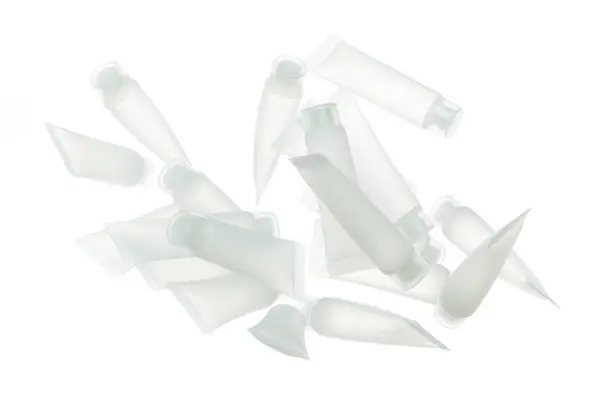 Καλλυντικό Δοχείο Λευκό Μπουκάλι Μύγα Πιτσιλίσματος Σωλήνας Διαφανής Στον Αέρα — Φωτογραφία Αρχείου