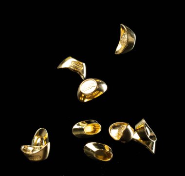 Chinese ornament gold ingot bar. Decoration element of chinese gold ingots or Yuanbao money for Festival. Other language mean rich wealthy prosperity. Black background isolated