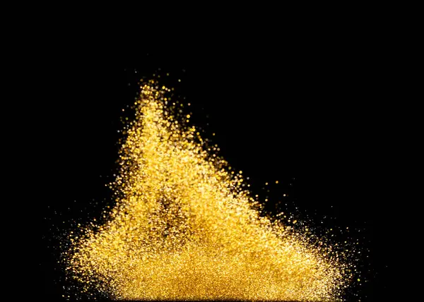 Gold metallic glitter sparkle explosion in air. Golden Glitter sand spark blink celebrate Chinese new year, fly throw gold glitters particle. Black background isolated, selective focus Blur bokeh