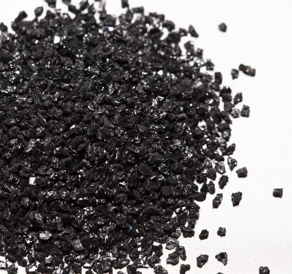 stock image Pile of Silicon Carbide. Black Silicon Carbide crash in small pieces as material based. Fine particle circle around, White background Isolated showing particle element object