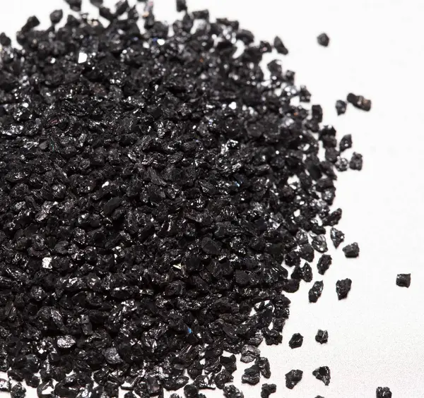 Stock image Pile of Silicon Carbide. Black Silicon Carbide crash in small pieces as material based. Fine particle circle around, White background Isolated showing particle element object