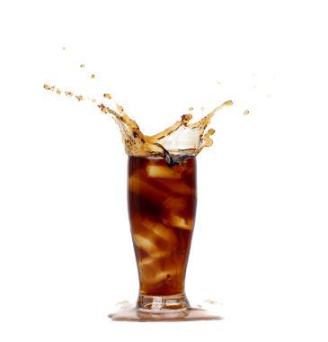 Ice Coffee Drink and Ice Tea tall glass splash up in Air. Cold brew ice coffee tea in cool glass drop splash and spill out of glass. White background isolated, high speed shutter freeze motion
