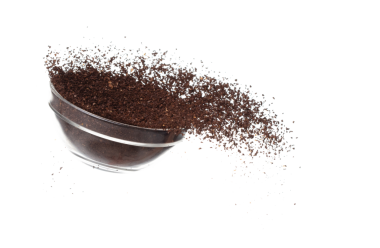 Coffee powder fall down pour in glass bowl, Coffee crushed float explode, abstract cloud fly. Coffee dust powder splash throwing in Air. White background Isolated high speed shutter, freeze motion