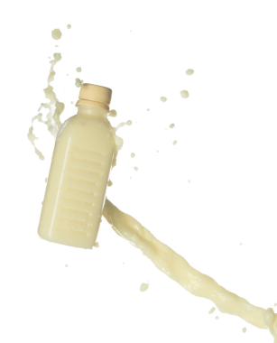 Soya fasulyesi sütü şişenin içine dökülüyor. Soya sütü ya da kozmetik krem nemlendirici boya renginde sıçrar. Beyaz arkaplan yüksek hız deklanşör dondurma hareketini izole etti