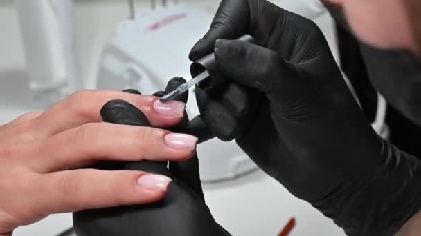 Manicure Service Manicurist Paints Her Nails Transparent Gel Polish Applying — Vídeos de Stock