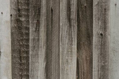 Large background texture of the wall of gray old wooden boards.