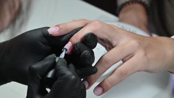 Manicure Service Manicurist Paints Her Nails Transparent Gel Polish Applying — Vídeo de stock
