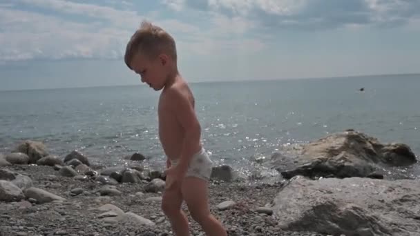 Cute Baby Boy Plays Stones Beach Seashore Climbs Rocks Summer — Wideo stockowe