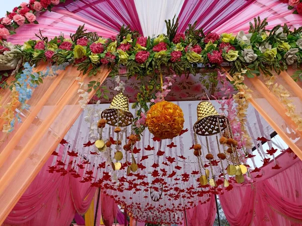 Decorative colorful entry gate for Indian marriage venue. made from cloth and wood himachal pradesh India 8