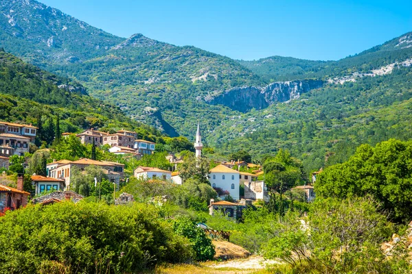 stock image The landscape of Doganbay village and stone house on a summer and sunny day. The concept of travel and tourism.