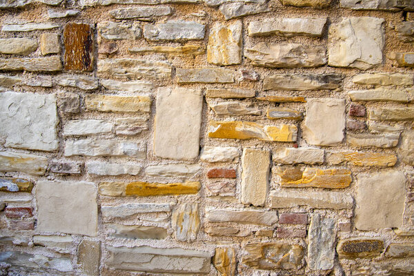 Ancient medieval stone wall texture background. The concept of architecture and texture.