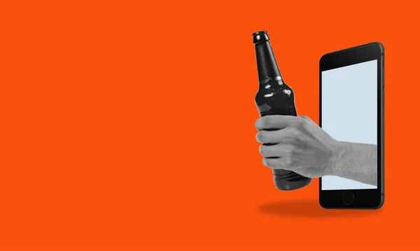 Art collage holding a bottle of beer from a phone on a red background with space for advertising. The concept of social media, influence, popularity, modern lifestyle, and advertising