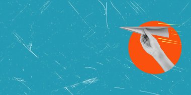 Hand holding a paper airplane against a circle background. Ideas for traveling. Art collage with copy space on blue background.