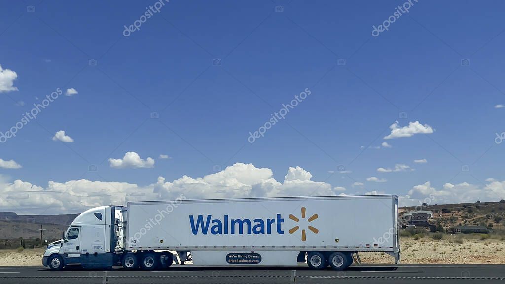 Walmart semi truck on Interstate-15 Eastbound, St. George, Utah  on a sunny day with clear blue sky and low clouds, copy space, editorial