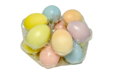 Pastel colored easter eggs stacked in round transparent packaging, sales display on white background, copy space clipart