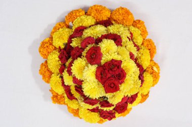 colorful flowers stacked up to create bathukamma, a specific hindu god worshiped in south india clipart