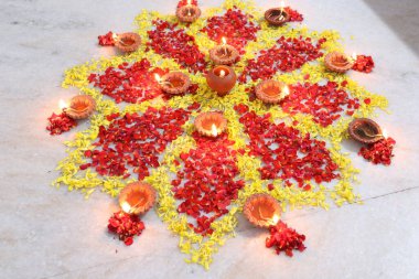 colorful flowers stacked up to create bathukamma, a specific hindu god worshiped in south india clipart