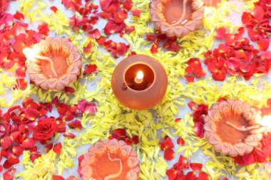 colorful flowers stacked up to create bathukamma, a specific hindu god worshiped in south india clipart