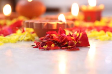 colorful flowers stacked up to create bathukamma, a specific hindu god worshiped in south india clipart