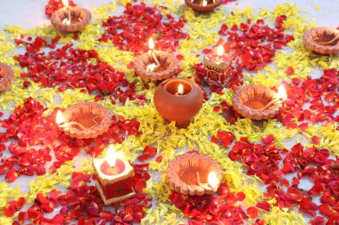 colorful flowers stacked up to create bathukamma, a specific hindu god worshiped in south india clipart