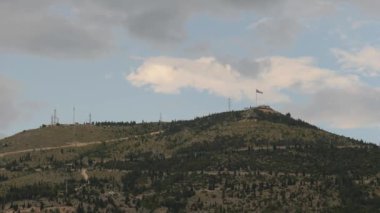 Bosnian Flag on a Hill, Patriotic Symbol, Bosnia and Herzegovina, Wide shot. High quality 4k footage