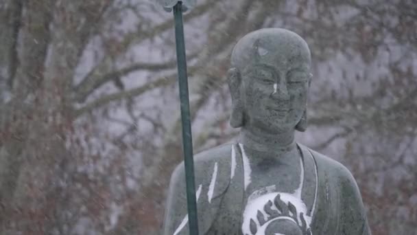 Buddhist Monk Statue Heavy Snowfall Buddhism Winter Season Medium Shot — Stockvideo