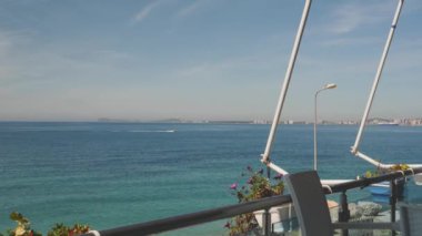 Albanian Riviera Waterfront Seen from Holiday Apartment Balcony, Pan shot. High quality 4k footage