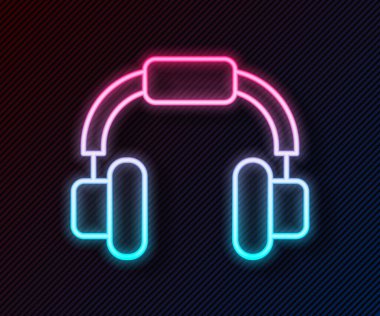 Parlayan neon hattı kulaklık simgesi siyah arkaplanda izole edildi. Kulaklıklar. Müzik, hizmet, iletişim ve operatör konsepti. Vektör.