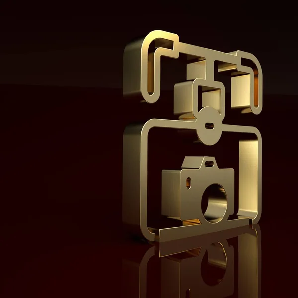 Gold Gimbal stabilizer with DSLR camera icon isolated on brown background. Minimalism concept. 3D render illustration.