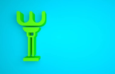 Green Rake toy icon isolated on blue background. Children toy for beach games. Minimalism concept. 3D render illustration.