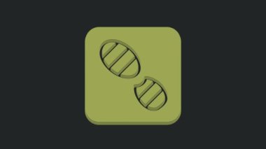 Yeşil insan ayak izi ayakkabı ikonu siyah arkaplanda izole edilmiş. Ayakkabı tabanı. 4K Video hareketli grafik canlandırması.