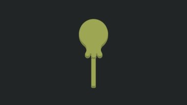 Yeşil lolipop simgesi siyah arkaplanda izole edildi. Yemek, lezzetli bir sembol. 4K Video hareketli grafik canlandırması.