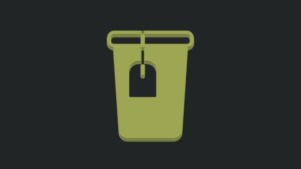 黒の背景にティーバッグのアイコンが隔離されたグリーンカップ 4Kビデオモーショングラフィックアニメーション — ストック動画