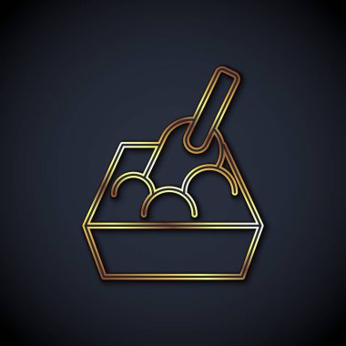 Gold line Cat litter tray with shovel icon isolated on black background. Sandbox cat with shovel.  Vector
