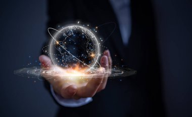 Businessman touching virtual globe with network communication and system linking with countries around the world. Concept of business and commercial communication through network.
