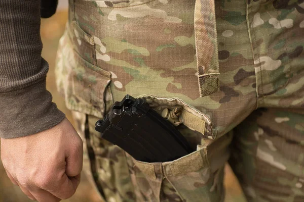 magazine from airsoft ak, in multicam pants pocket